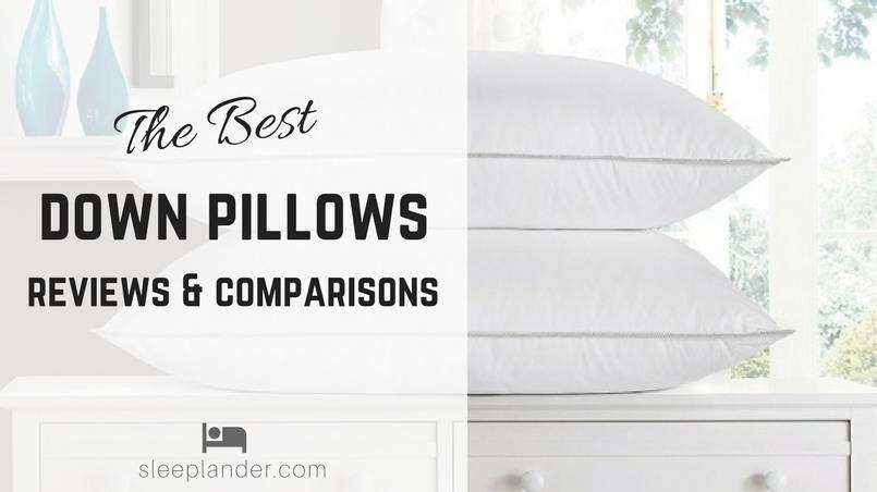 A pair of luxury down pillows on a nightstand