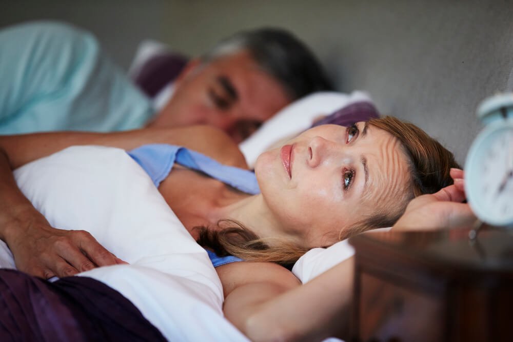 Female osteoarthritis sufferer difficulty sleeping