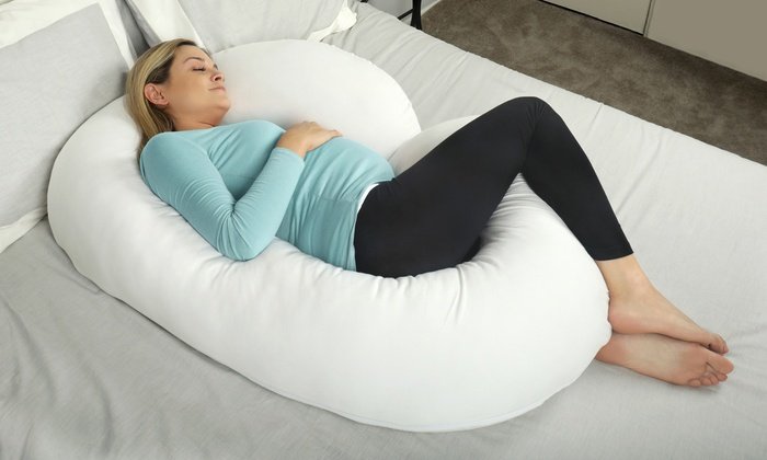 Pregnant Woman Sleeping Using a Full Pregnancy Pillow