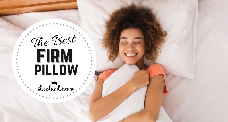 Young woman hugging a firm pillow waking up in bed