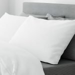 A bed with mix and match percale sheets and matching pillowcases