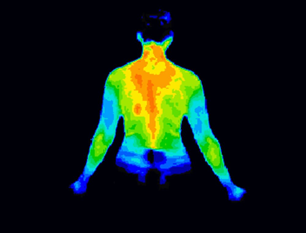 Celliant-powered bedding can help with promoting better sleep - an infra red image of a man as he sleeps.