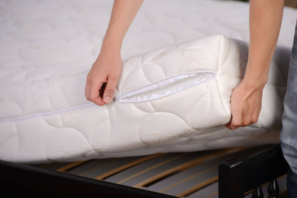 Encasing a mattress with a mattress encasement
