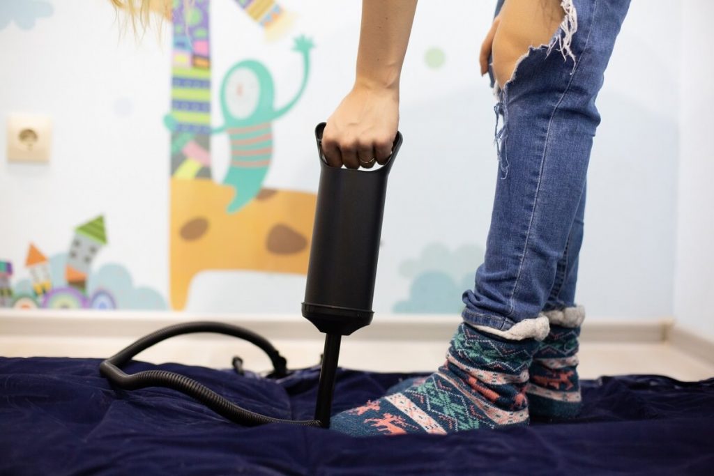 Pumping an air bed with a pump