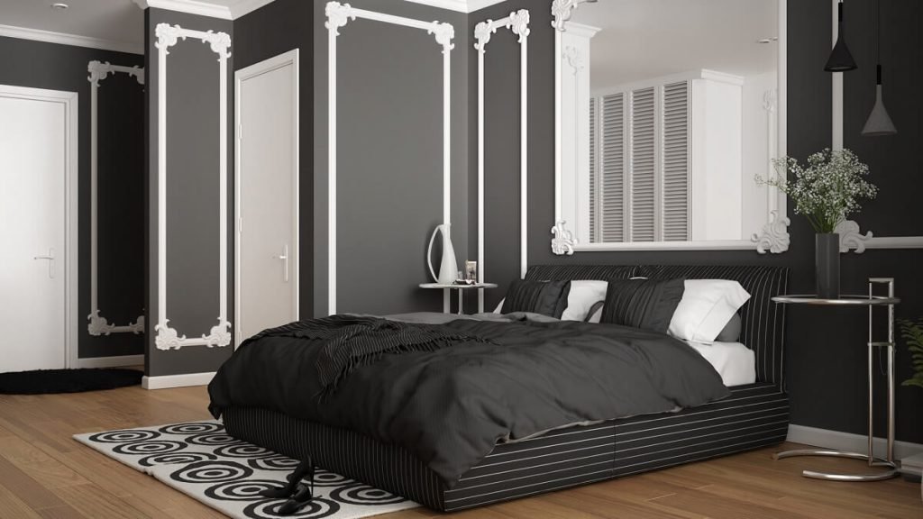 Modern white and gray bedroom in classic room with wall moldings, parquet, double bed with duvet and pillows, minimalist bedside tables, mirror and decors. Interior design concept