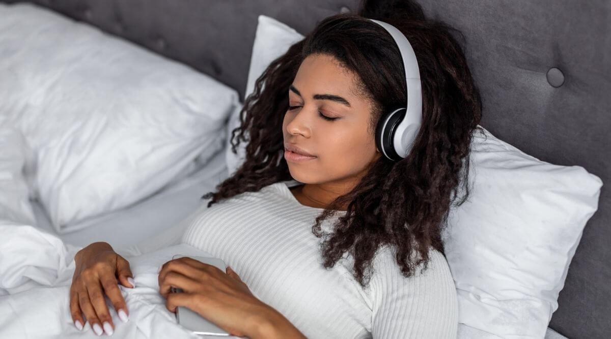 Young woman sleeping with headphones