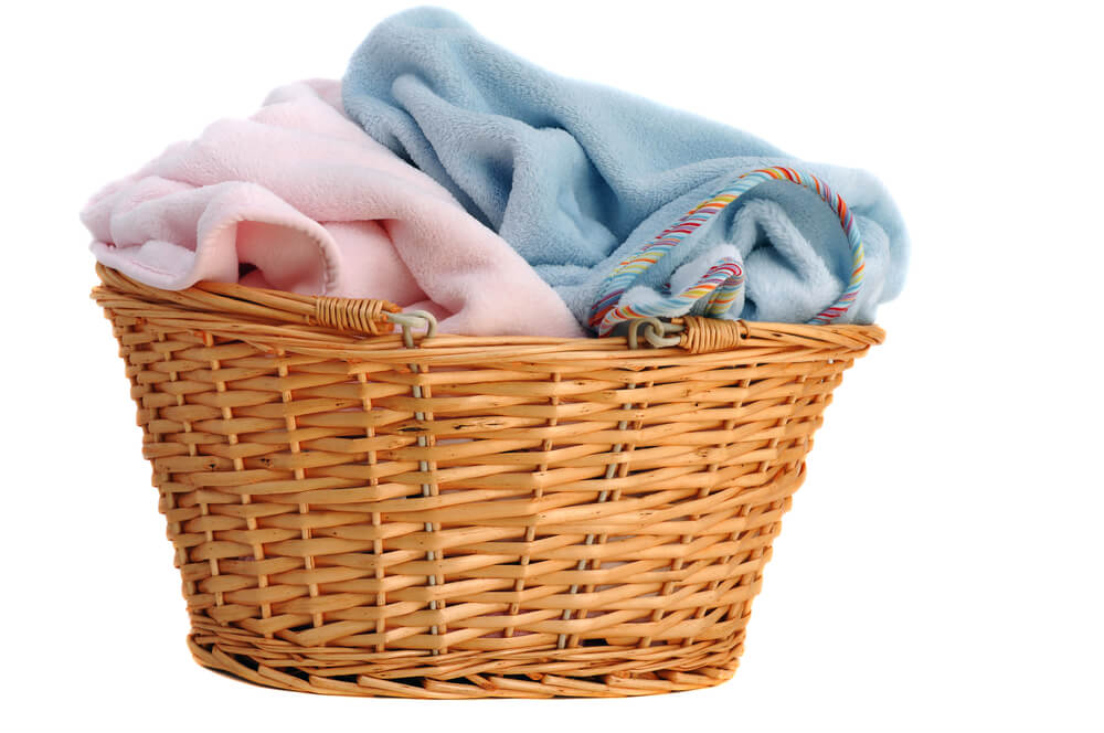 Baby soft fleece blankets in a laundry basket